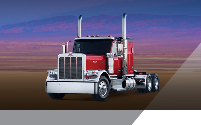 Peterbilt Model 589 truck in front of colorful background