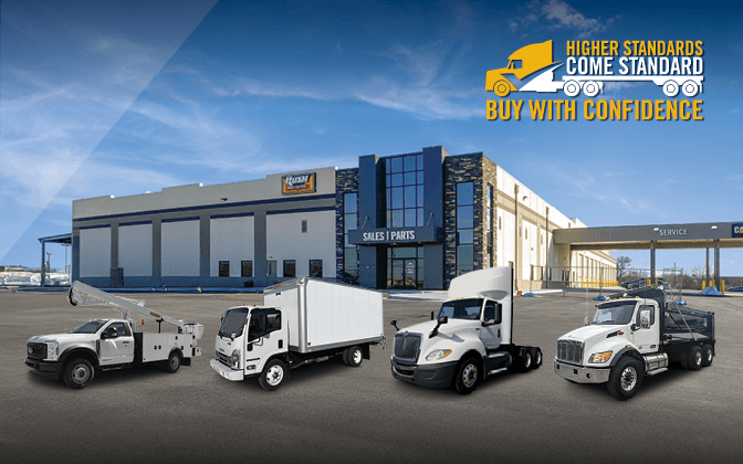 Lineup of commercial trucks | Higher Standards Come Standard, Buy With Confidence Logo