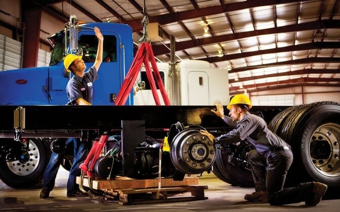 Custom Vehicle Solutions employees working on truck