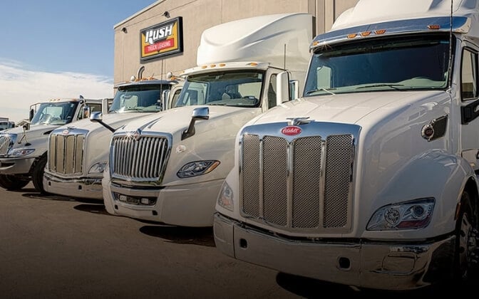 Trucks Lined Up Outside Rush Truck Leasing Building
