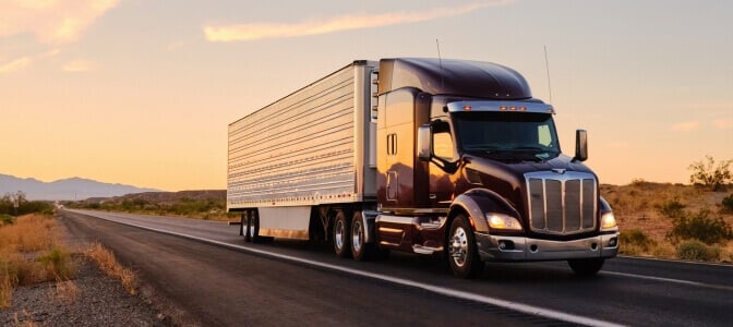 Peterbilt truck driving down highway