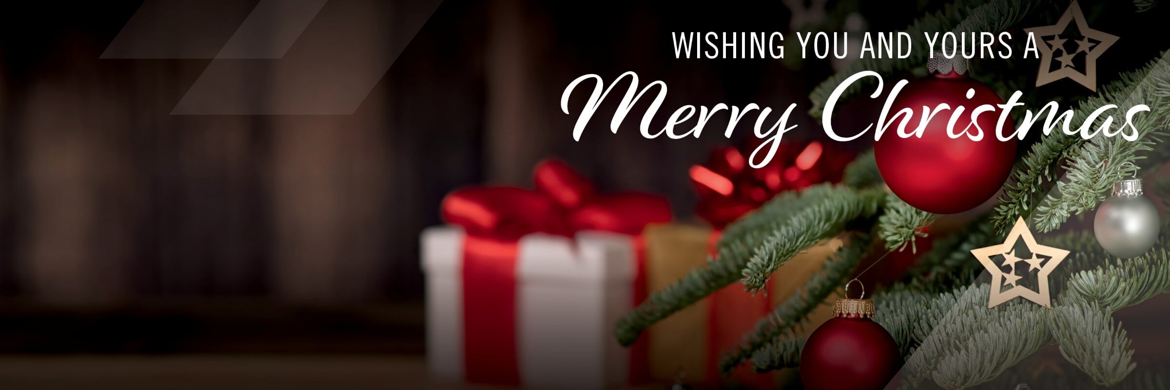 Close up of Christmas tree with red ornaments and stars