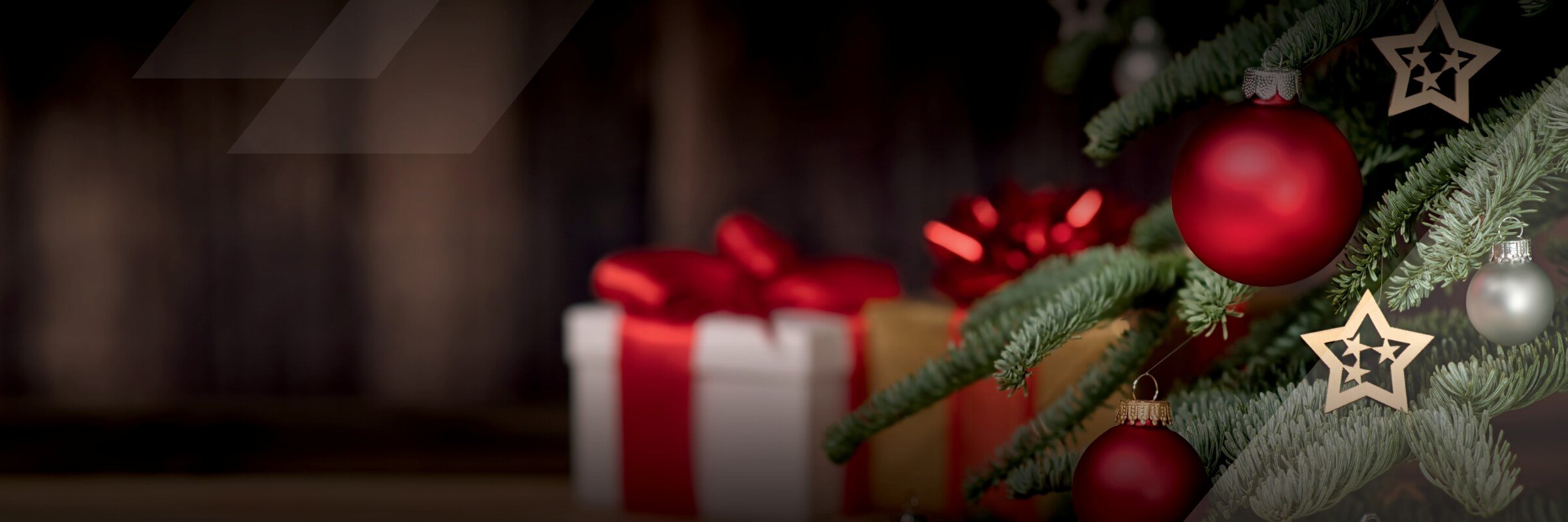 Close up of Christmas tree with red ornaments and stars