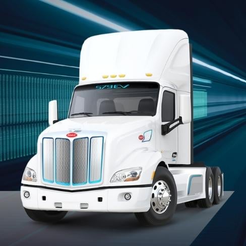 White electric Peterbilt Model 579EV truck