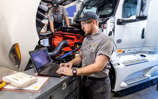 Rush Truck Centers technician using laptop