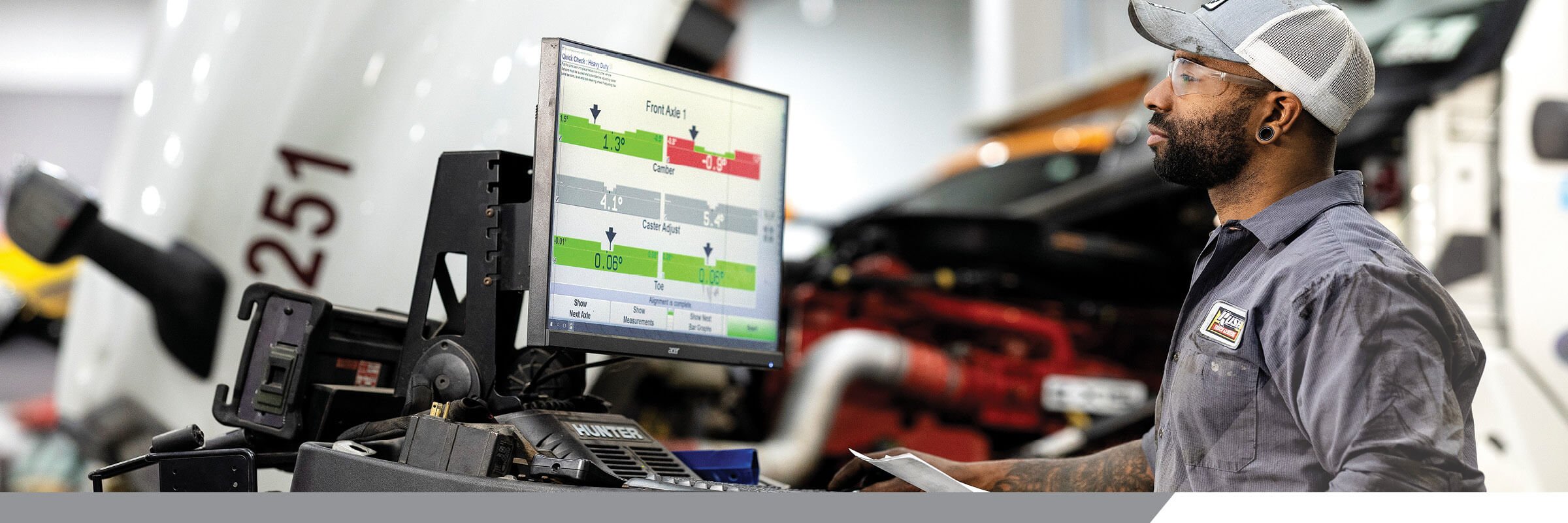 Rush Truck Centers technician looking at chart on computer screen