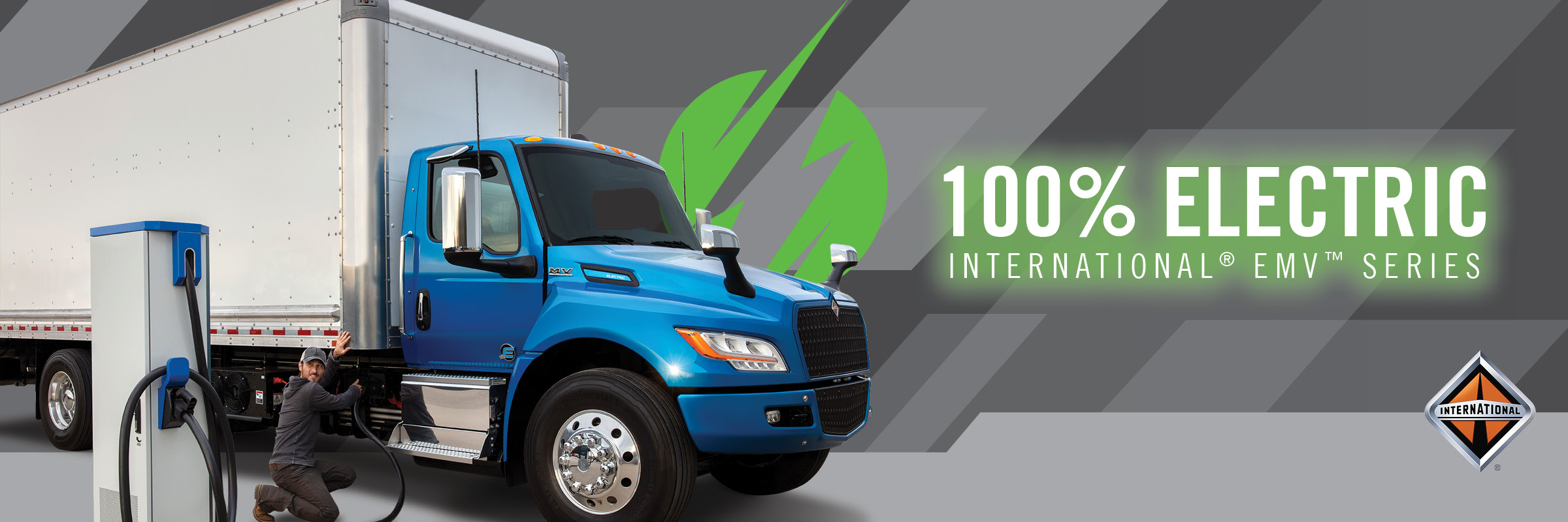 100% Electric International eMV Series truck being charged by driver
