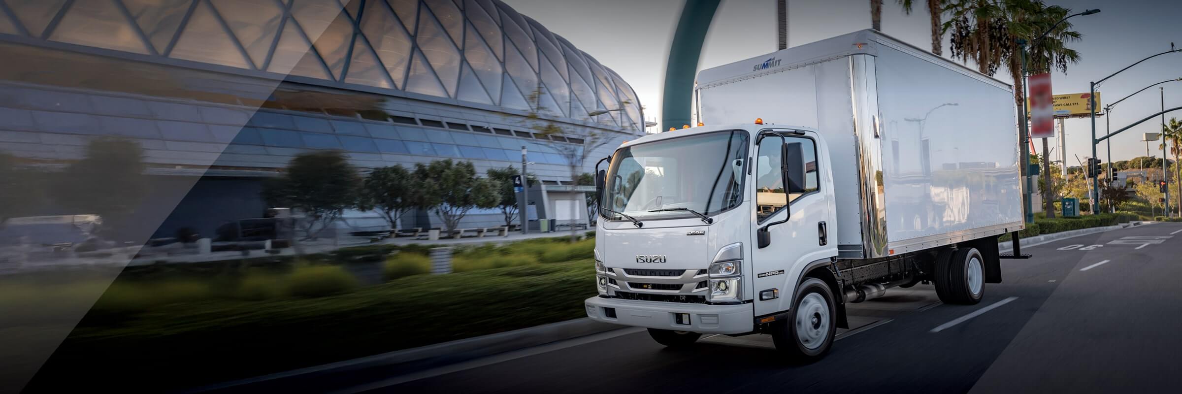 Isuzu NPR-HD Gas driving down road