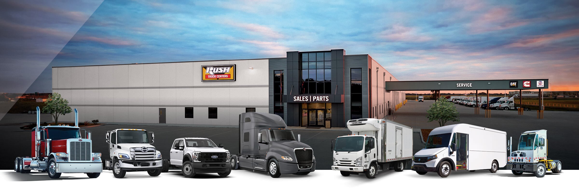 Line up of commercial vehicles from Peterbilt, International, Hino, Isuzu, Ford, Autocar and Blue Arc