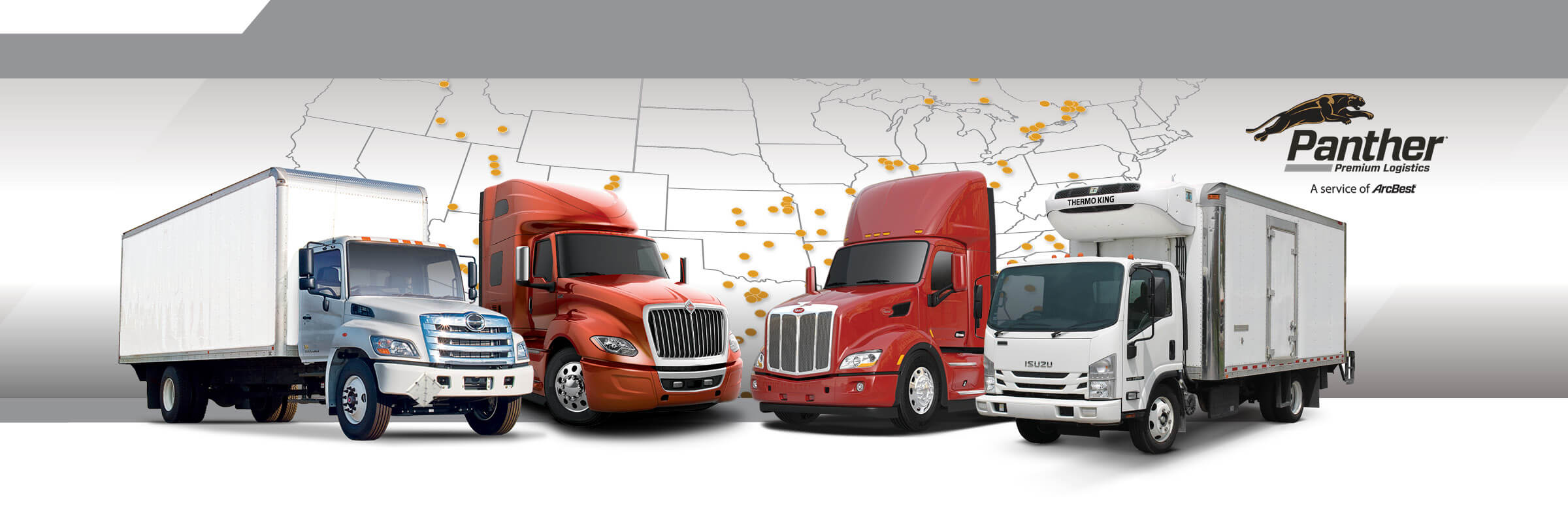 Lineup of assorted trucks with Panther Premium Logistics logo