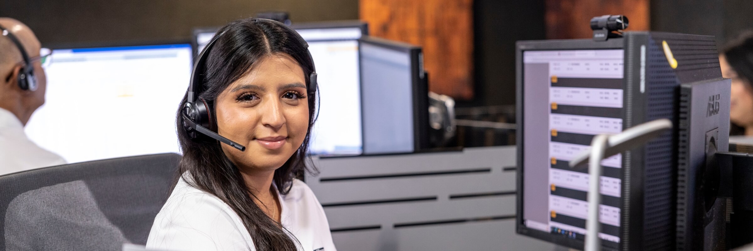 RushCare call center employe sitting at computer