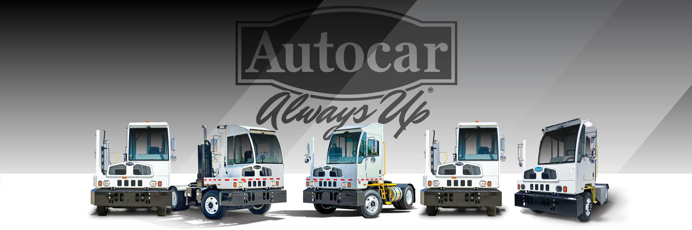 Line up of Autocar ACTT terminal tractors