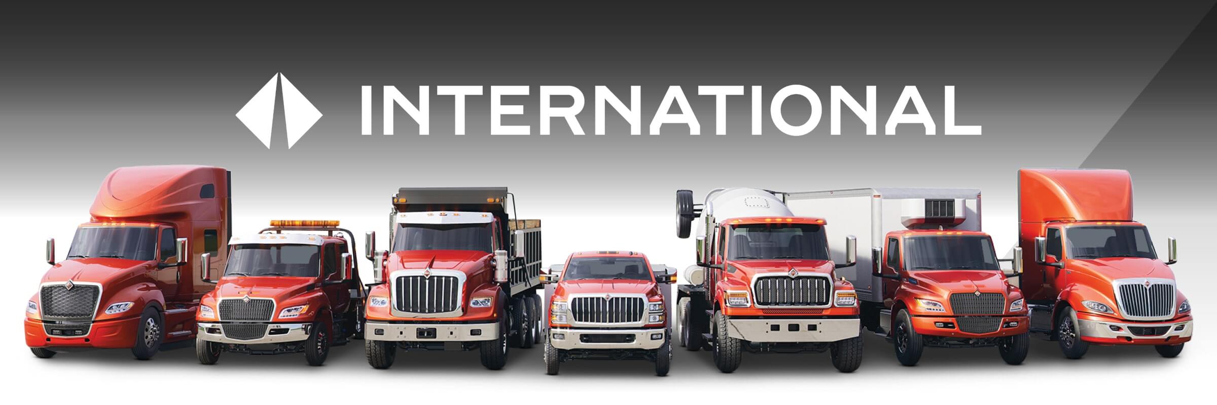 Line up of International trucks with International logo