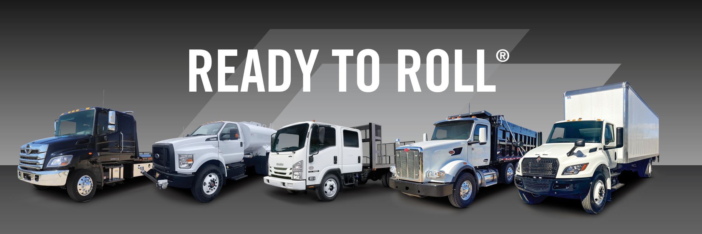 Ready to Roll Trademark with Line up of 5 bodies up vocaitonal trucks | Hino flatbed truck | Ford water tank truck | Isuzu landscape truck | Peterbilt dump truck | International box truck