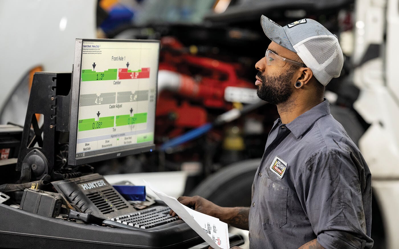 Rush Truck Centers technician looking at computer screen